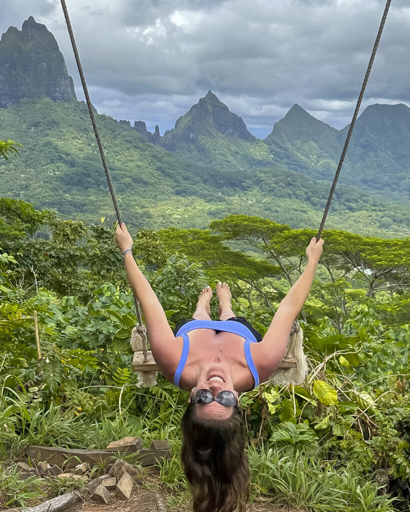 Girl on swing on the mountain of Moorea French Polynesia