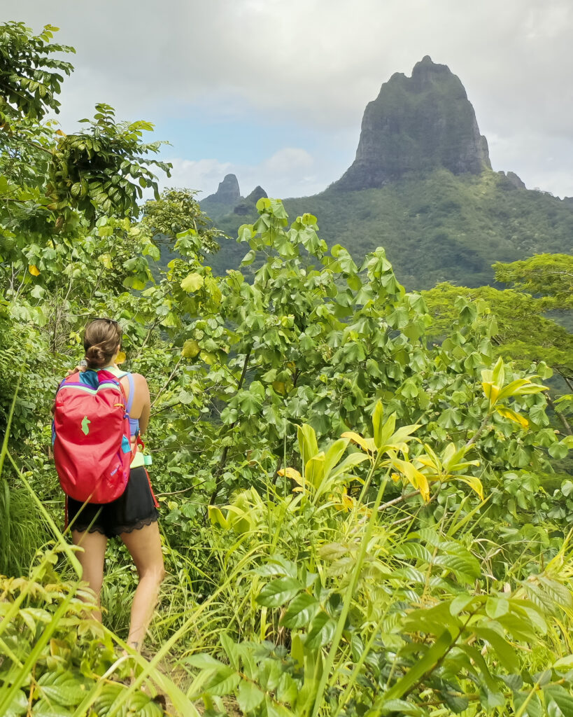 girl on the mountain in moorea with Cotopaxi backpack