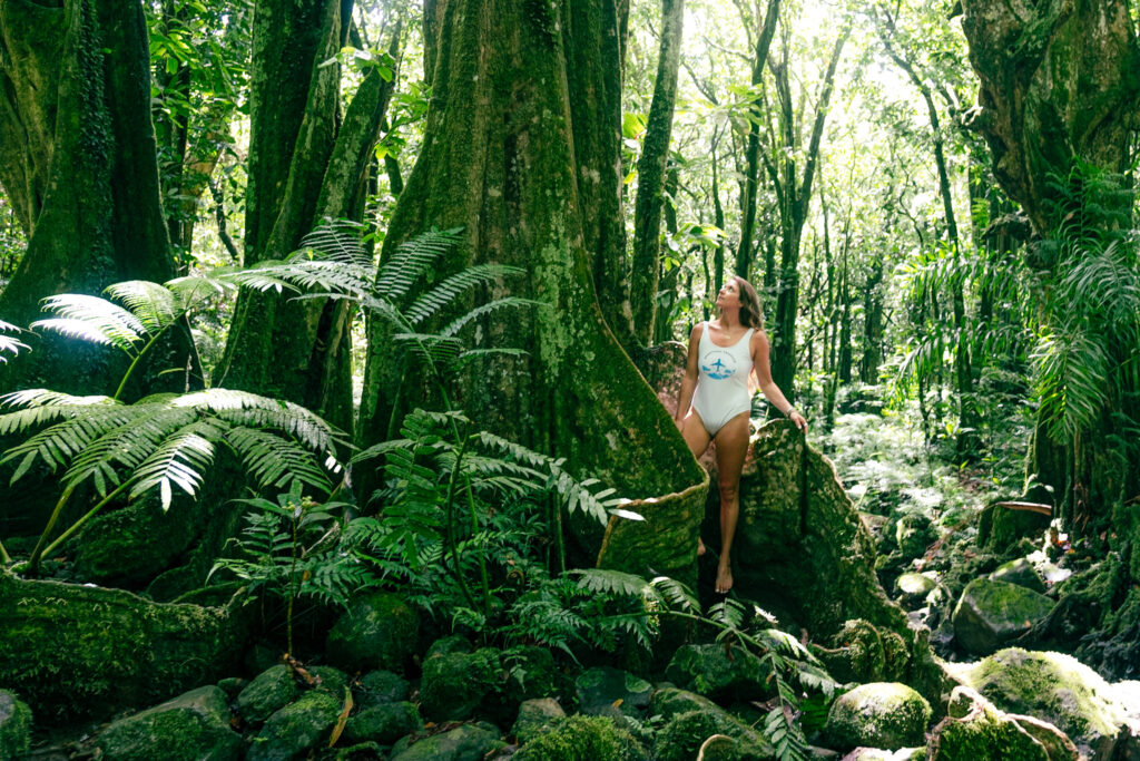 girl in the jungle and mountain of moorea 