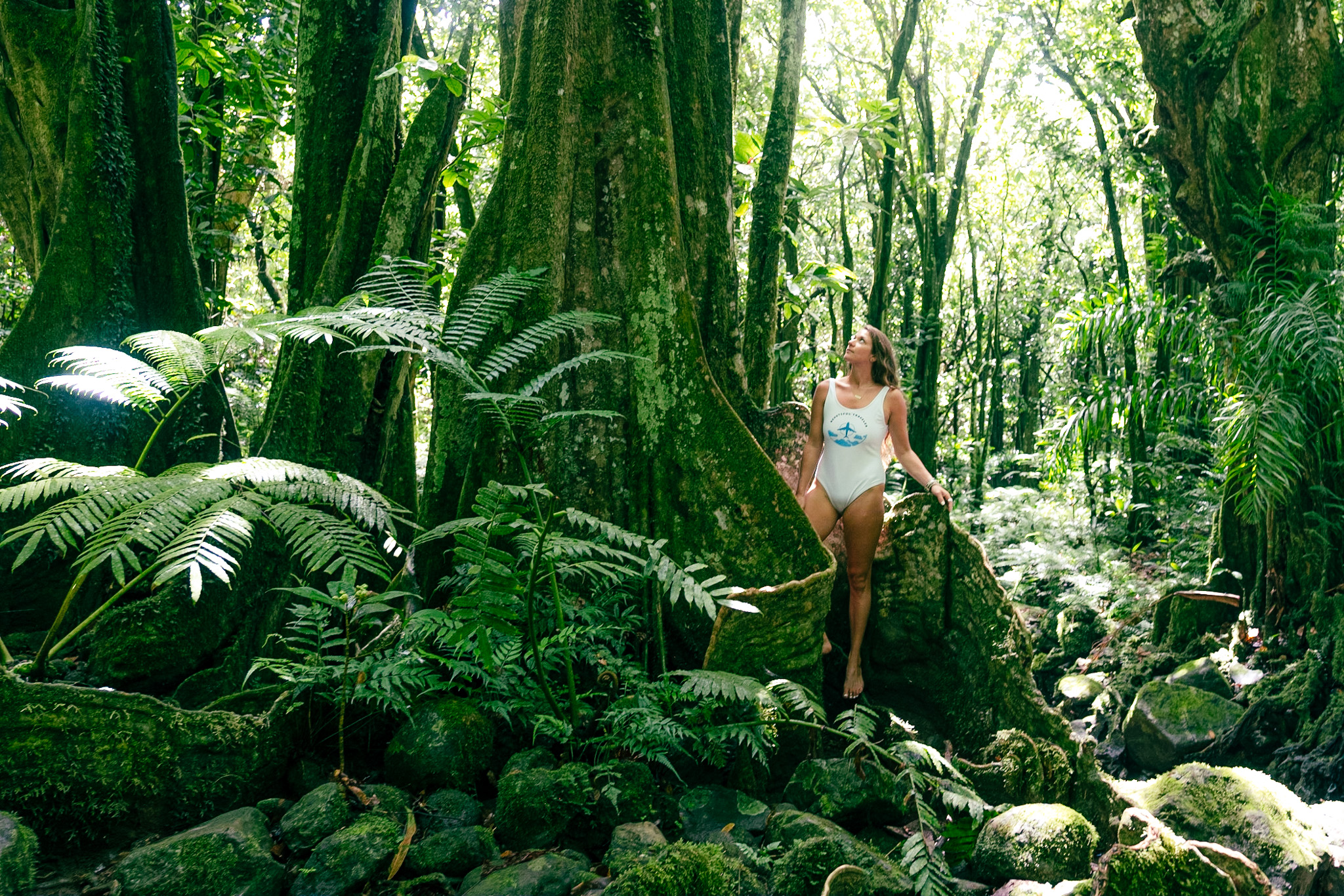 girl in the jungle and mountain of moorea