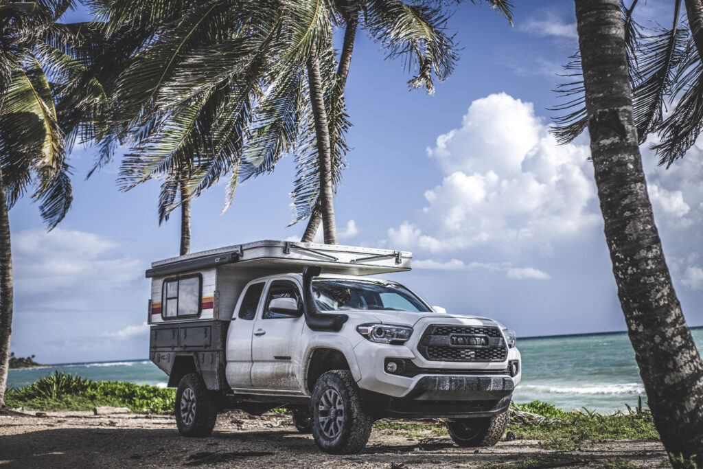 Toyota Tacoma with Four Wheel Camper on the beach in Tulum Mexico